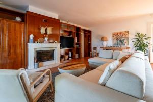 a living room with a couch and a fireplace at House in Villa Torto in Monopoli