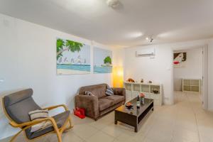 a living room with a couch and a chair and a table at El Doctoral in Vecindario