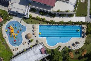 an overhead view of a swimming pool in a backyard at NDC Resort & Spa in Manado +115 photos