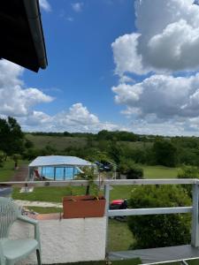 a view from the balcony of a house with a plant at Gite Le Paradis in Pern