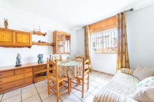 a living room with a table and a couch at Casa Rural La Buganvilla in Níjar