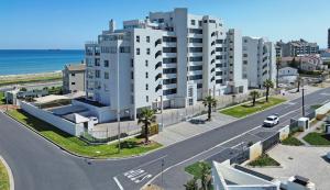 an aerial view of a building on the beach at Nautica by the Sea in Cape Town