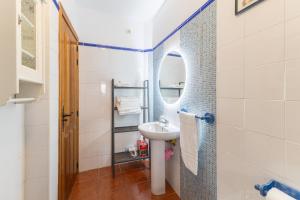 a small bathroom with a sink and a mirror at De los Maestros in El Arenal +20 photos