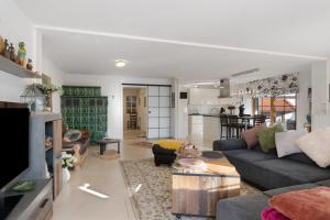 a living room with a couch and a table at Feriendomizil Berta Benzingen 1 in Winterlingen