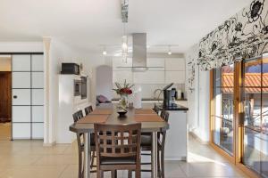 a kitchen and dining room with a table and chairs at Feriendomizil Berta Benzingen 1 in Winterlingen