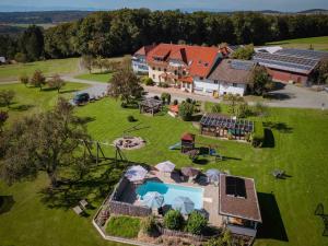 an aerial view of a house with a swimming pool at Ferienhaus Bührer in Freiamt