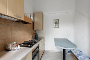a small kitchen with a stove and a counter top at Agriturismo Green House in Santo Stefano al Mare +33 photos
