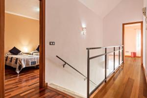 a room with a bedroom with a bed and a mirror at Duplex Pedroza in Pozo Izquierdo