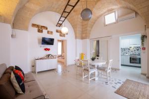 a living room with a couch and a table at Nuvò-Lux e Spa in Veglie