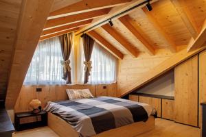 a bedroom with a bed and a large window at Dimora Vacanze in Mezzano +53 photos