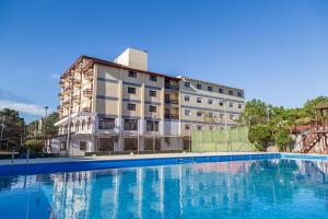 a large swimming pool in front of a building at Hotel Bel Sur in San Bernardo