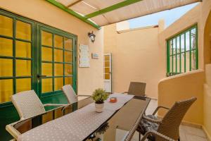 a dining room with a table and chairs at Casa Relax in Costa Calma