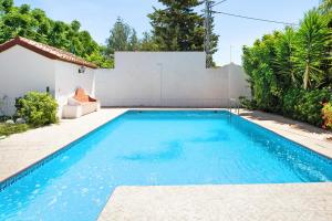 a swimming pool in the backyard of a house at Casa Paqui 2 in Roche