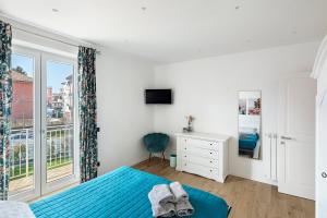 a bedroom with a blue bed and a window at Principe Di Agerola in Agerola