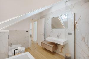 a white bathroom with a sink and a mirror at Principe Di Agerola in Agerola +29 photos