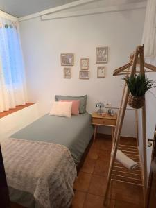 a bedroom with a bed and a plant on a ladder at Residencial Primavera in Arona +27 photos
