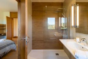 a bathroom with a shower and a sink at Villa Monasterio in Camargo +25 photos