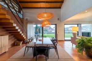 a dining room with a table and chairs at Villa Monasterio in Camargo