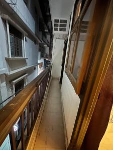 a hallway of a kitchen with a long floor at Spiritual Oasis in Rishīkesh +1 photo