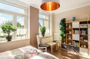 a bedroom with a bed and a book shelf at Fewo Theo im Ferienhaus Alte Schule in Ferna