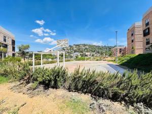 a basketball hoop in the middle of a parking lot at Casa Sto Domingo terraza PB 3KM del centro in Oaxaca City