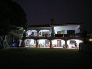 a large house with a balcony at night at Chichen Itza in Moraira +70 photos