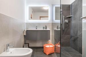 a bathroom with a sink and a shower at Trojer Apartment 1 in Sarntal +21 photos