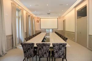 a large conference room with a long table and chairs at Maison Bourgeoise de caractère in Tarare