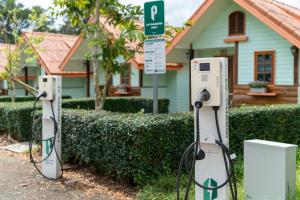 a couple of hydrogen fueling machines in front of a house at Samprasob Resort in Sangkhla Buri