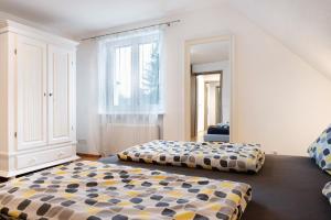 a bedroom with two beds and a window at Fewo Walk in Salem