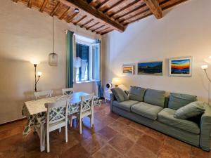 a living room with a couch and a table at Casa Caterina in Portoferraio