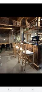 a group of chairs and a table in a restaurant at Herzleierhof Rodeneck in Rodengo