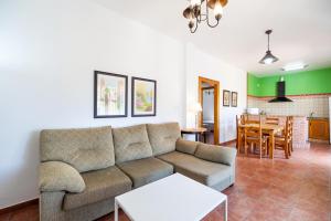 a living room with a couch and a table at Luisa 3 in Conil de la Frontera