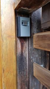 a wooden door with an electrical box on it at Den Bergen Ganz Nah in Pfronten