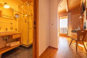 a bathroom with a shower and a sink at Rossalm in Brixen