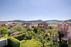 a view of a town with houses and trees at Ferienwohnung Lange in Waldstetten