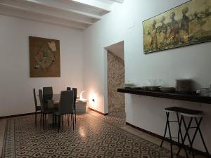 a dining room with a table and chairs at Casa Privada in Vejer de la Frontera