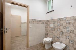 a bathroom with a toilet and a sink at Bella veduta Luna in Agerola +13 photos