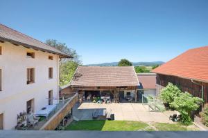 an aerial view of a building with a patio at Schwarzbauernhof in Eschlkam