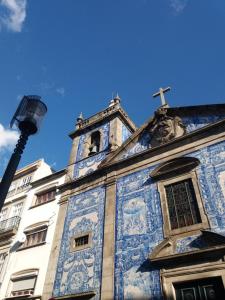 a building with a cross on top of it at PicPorto Apartment in Porto