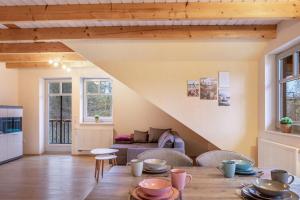 a living room with a table and a couch at Ferienhaus Hof Schäfer in Waldeck