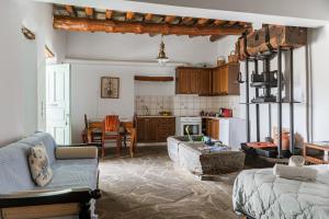 a kitchen and living room with a couch and a table at Olive Guesthouse near farm in Fállika
