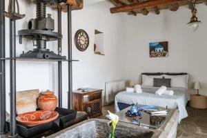 a living room with a bed and a table and a couch at Olive Guesthouse near farm in Fállika