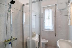 a bathroom with a shower and a toilet and a sink at La Ca' Di Marì in Costarainera +13 photos
