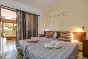 a bedroom with two beds with towels on them at Studio with Private Garden in Lagos
