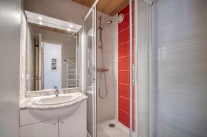 a bathroom with a sink and a shower at Appartement N° 46 in Les Menuires +8 photos