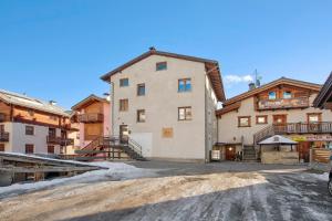 a large building in the middle of a dirt road at Lovin Summer in Livigno