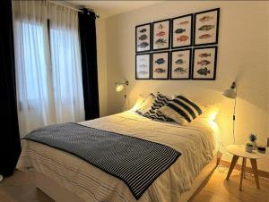 a bedroom with a large bed and a window at Eden Mar Calonge Girona in Calonge +31 photos
