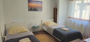 a bedroom with two beds and a window at E"STEIN 3 ZKB Balkon in Koblenz