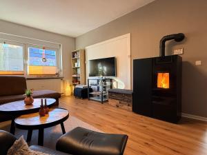 a living room with a fire place in a living room at Ferienwohnung Glückauf in Castrop-Rauxel